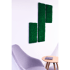 Reference image of Polarmoss Flex Element. green colored moss wall panel beside armchair.